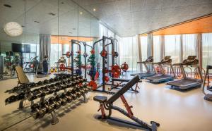 a gym with a bunch of treadmills and machines at Maistra Select Family Hotel Amarin in Rovinj
