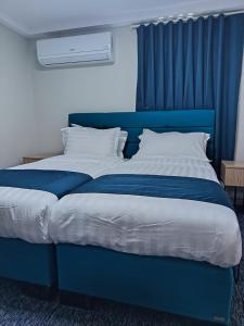 En eller flere senge i et værelse på Jabira