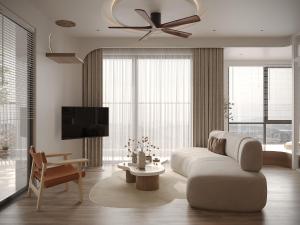 a living room with a couch and a ceiling fan at Cozy Room Featuring Local Rattan & Bamboo in Ho Chi Minh City