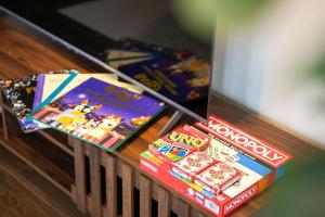 a table with some games on top of it at Seednest BBQ Cozy Family house in Alfredton