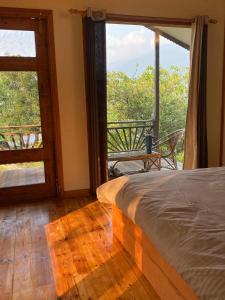 Ένα ή περισσότερα κρεβάτια σε δωμάτιο στο The Goat Village