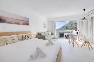 En eller flere senge i et værelse på Siesta Style