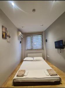 a large bed in a room with a window at 3A House - Sultanahmet in Istanbul