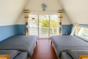 Postel nebo postele na pokoji v ubytování OnTheHill Hotel