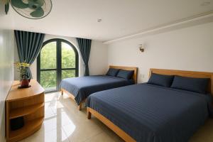 Postel nebo postele na pokoji v ubytování OnTheHill Hotel + 11 fotografií