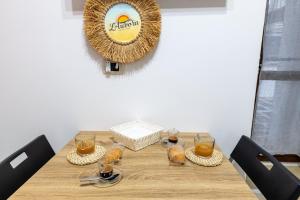 a table with glasses of orange juice on it at L'aurora in San Vito dei Normanni