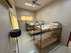 Ένα ή περισσότερα κρεβάτια σε δωμάτιο στο GS Homestay Whole Villa