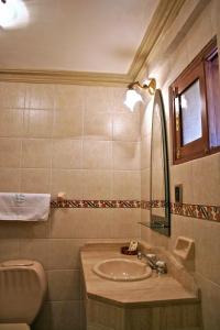 A bathroom at San Marino Royal Hotel