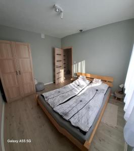 En eller flere senge i et værelse på Agroturystyka nad stawem