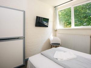 Postel nebo postele na pokoji v ubytování Splendid cabin in camping resort