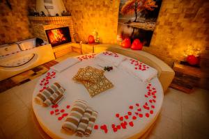 a large white cake with red hearts on top of it at "Il Quercione" Room With SpA in Lama Di Peligni +46 photos