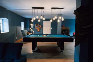 a living room with a pool table in it at Zur alten Oelmuehle Wellness & Entertainment in Ahrhütte