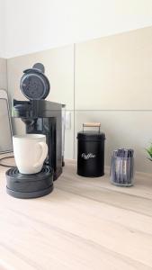 a coffee maker sitting on top of a counter at HYGGE HOMES - Apartment 'Stilla' in Celle