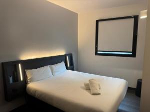 Postel nebo postele na pokoji v ubytování Flex Malaga City Center + 6 fotografií