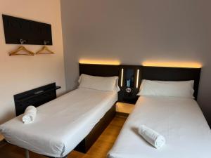 Postel nebo postele na pokoji v ubytování Flex Malaga City Center