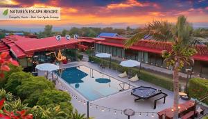 an aerial view of a hotel with a swimming pool at Suchanan Resort Rayong in Ban Chang
