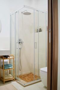 a shower with a glass door in a bathroom at ARCU DE CHELU - GUEST HOUSE in Modolo +41 photos