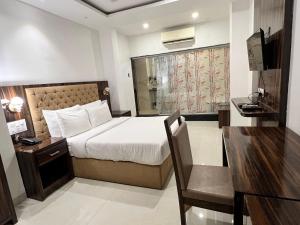 Postel nebo postele na pokoji v ubytování Grand Tulsi + 43 fotografií