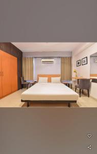 Ένα ή περισσότερα κρεβάτια σε δωμάτιο στο Hotel me-casa inn