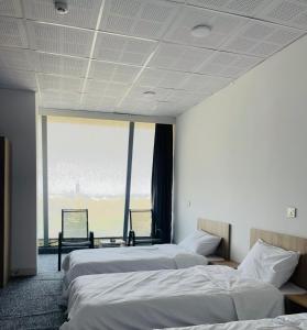 Ένα ή περισσότερα κρεβάτια σε δωμάτιο στο Hotel Midyat +3 φωτογραφίες