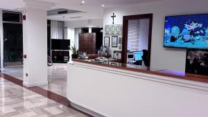 TV a/nebo společenská místnost v ubytování Venice Hotel con Colonnine Elettriche