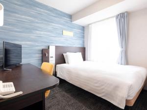 Postel nebo postele na pokoji v ubytování Comfort Hotel Tokyo Kiyosumi Shirakawa