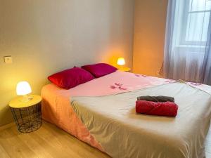 Ένα ή περισσότερα κρεβάτια σε δωμάτιο στο Le petit Carnot WIFI centre-ville