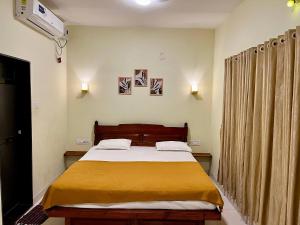 Postel nebo postele na pokoji v ubytování PALM VISTA HOMESTAY