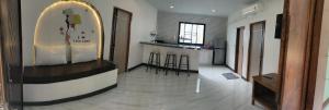 a room with a kitchen with a counter and a bar at BAAN PAHK JAI by Dragon hut in Hinkong +7 photos