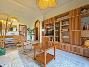 a living room with a table and a couch at Villetta Tonfano in Marina di Pietrasanta +19 photos