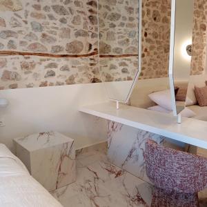 Ένα ή περισσότερα κρεβάτια σε δωμάτιο στο Nalia Suites