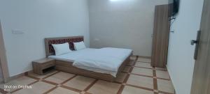 Postel nebo postele na pokoji v ubytování Chand Homestay