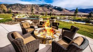 a patio with a table and chairs and a fire pit at Impressive and Secluded Villa for Rent along the Glorious Uinta Mountains, Utah in Oakley