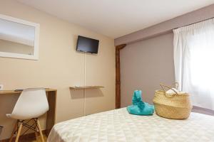 TV a/nebo společenská místnost v ubytování Pensión Úbeda