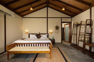 a bedroom with a large bed in a room at The Wave , Palolem in Canacona