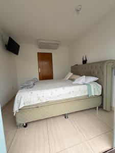 Giường trong phòng chung tại Quarto Ágape