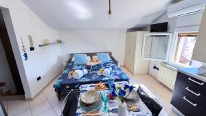 a small room with two beds and a table at Ca’ Marea by Ca-Sa Check in Sottomarina