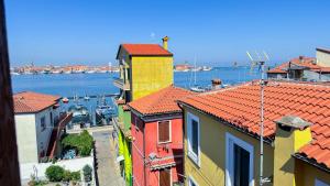 a view of a city with boats in the water at Ca’ Marea by Ca-Sa Check in Sottomarina