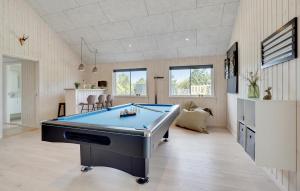 a billiard room with a pool table in it at Cozy Home In Glesborg With Sauna in Fjellerup +12 photos