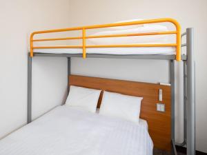 Ένα ή περισσότερα κρεβάτια σε δωμάτιο στο Comfort Inn Zentsuji Inter