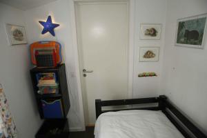 a bedroom with a bed and a star on the wall at Child-Friendly Holiday 500 Meters From The Beach in Nykøbing Sjælland
