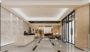 a hallway of a building with a large lobby at Friendly Bersama Villa in Medan