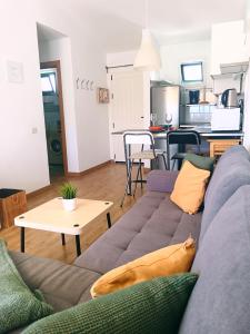 a living room with a couch and a table at Dreams Paradise Puerto Rico in Puerto Rico de Gran Canaria