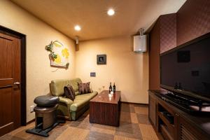 TV a/nebo společenská místnost v ubytování ホテルミント羽島