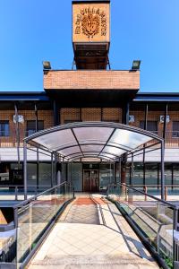 a building with a clock tower on top of it at Hotel Villamayor by gaiarooms in Villamayor