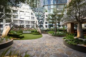 a garden in the middle of a building at Brand New Luxury Stay with Garden View Same Tower as Ritz Carlton in Melbourne