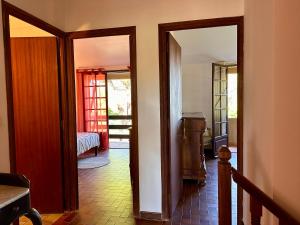 a hallway with two doors leading to a bedroom at Villa Caline, 4 chambres, lotissement calme et proche mer in Lucciana +29 photos