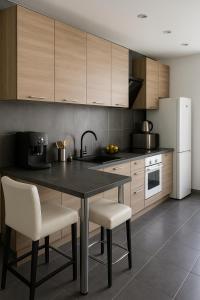 Kuchyň nebo kuchyňský kout v ubytování Les vacances