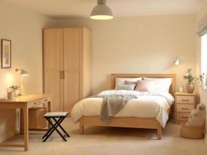 a bedroom with a bed and a desk at La Grande Maison Paris Sud in Vitry-sur-Seine