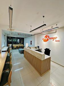 a restaurant with a bar with a sign on the wall at Amango Home Brand 5 in Ho Chi Minh City
